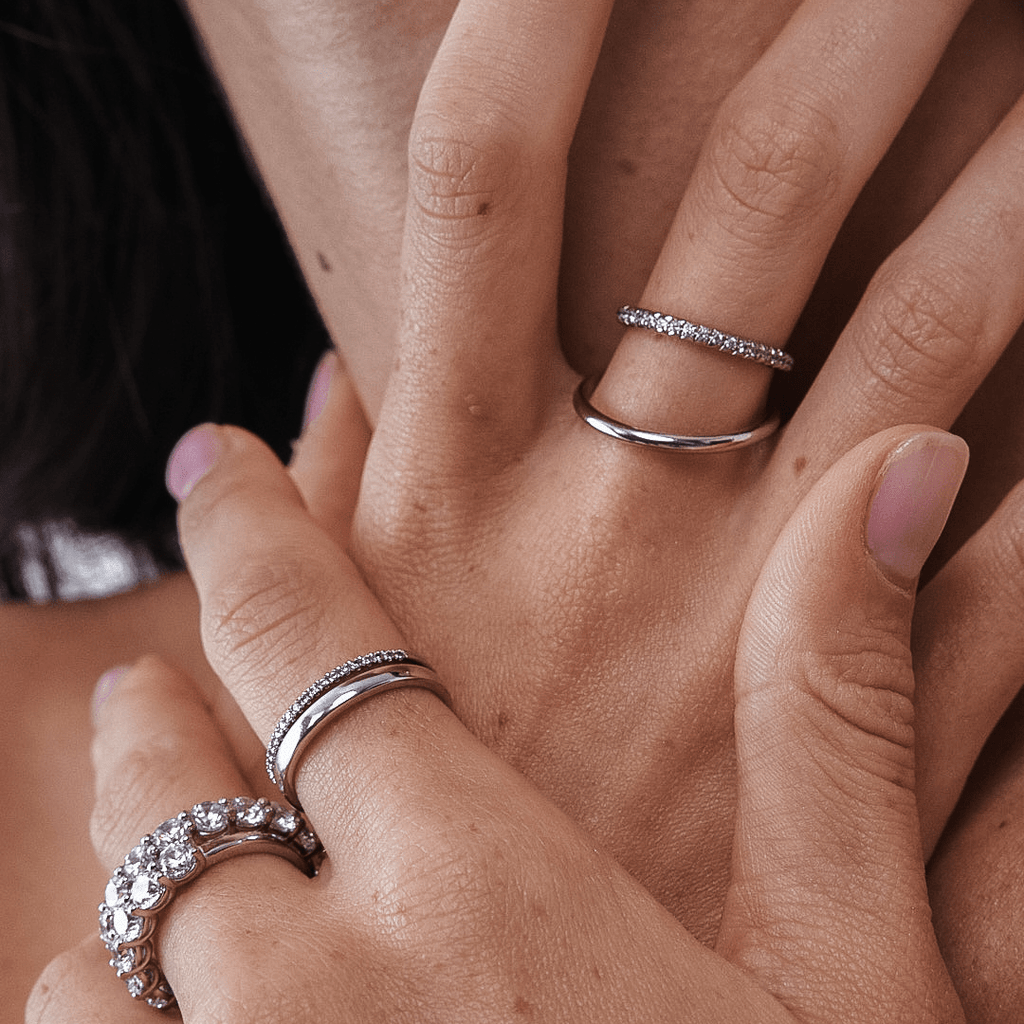 Plain and Diamond Wedding Bands and Eternity Rings on Finger Hand